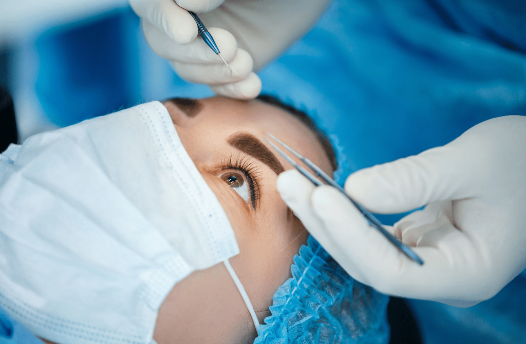 Surgeon performing a corneal transplant surgery to replace a damaged cornea and restore vision.